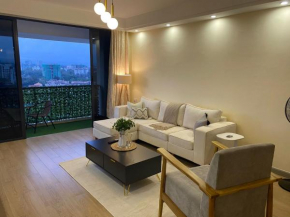 metro living retreat apartment with heated swimming pool,fully equipped gym,ample parking space,and a relaxing rooftop with breathtaking views